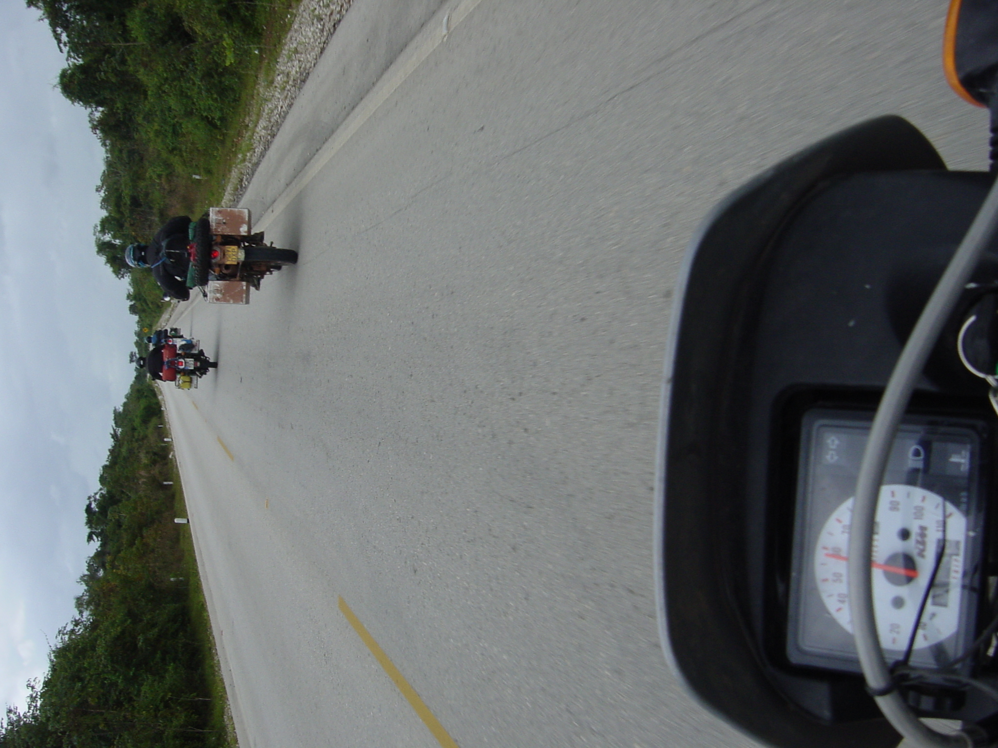 Riding with the 2 German Lads we met - And yes mum, we are putting safety first, see I was only doing 100km/h when taking the photo