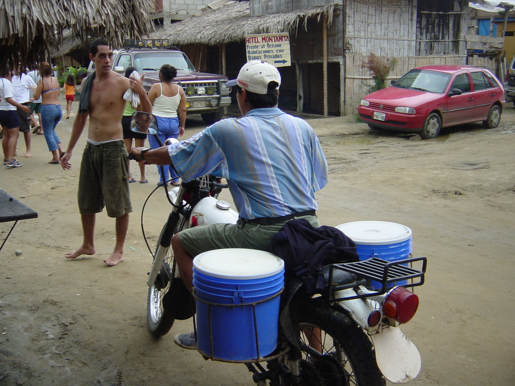 The milk man, it gets sold by the cup tipped into a plastic bag. There is also a possibility of buying yoghurt off him in the afternoons if the day is hot enough and conditions right in the buckets.