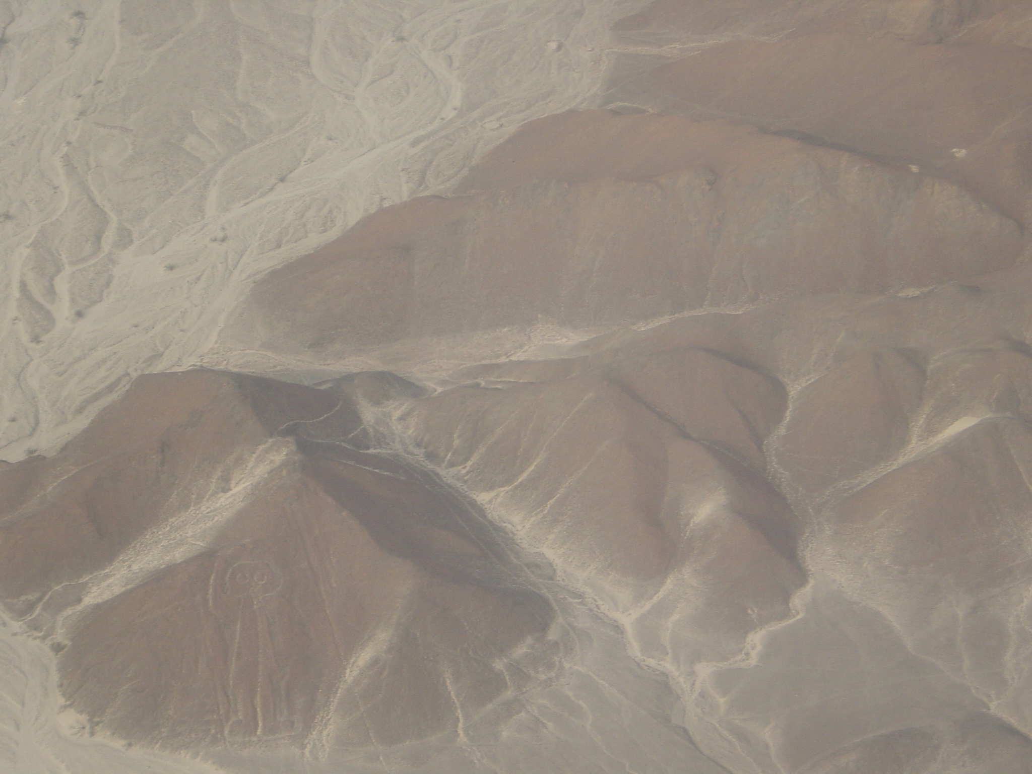 In the bottom left corner is the Nazca line's picture of a spaceman