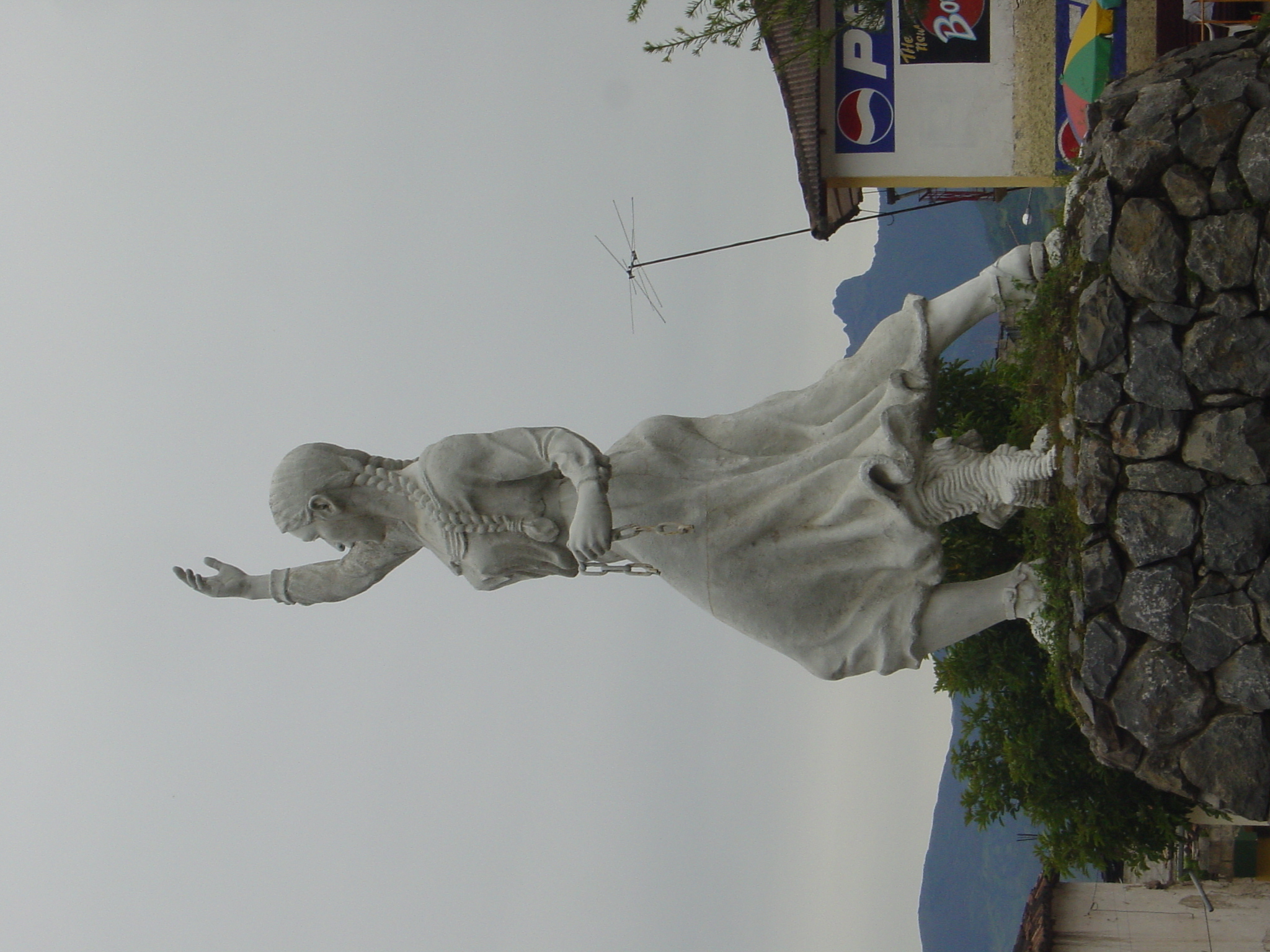 Woman breaking free from the shackles of her oppression... and with a tree trunk up her skirt!