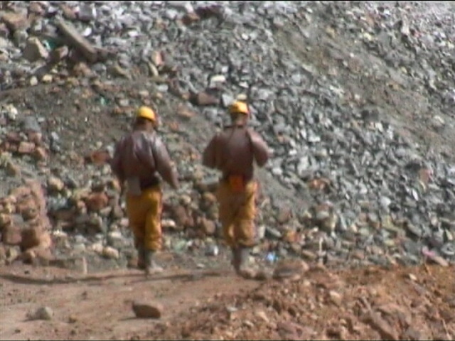 Don’t Trip - Martin & Jamie walking with Dynamite with lit fuses.