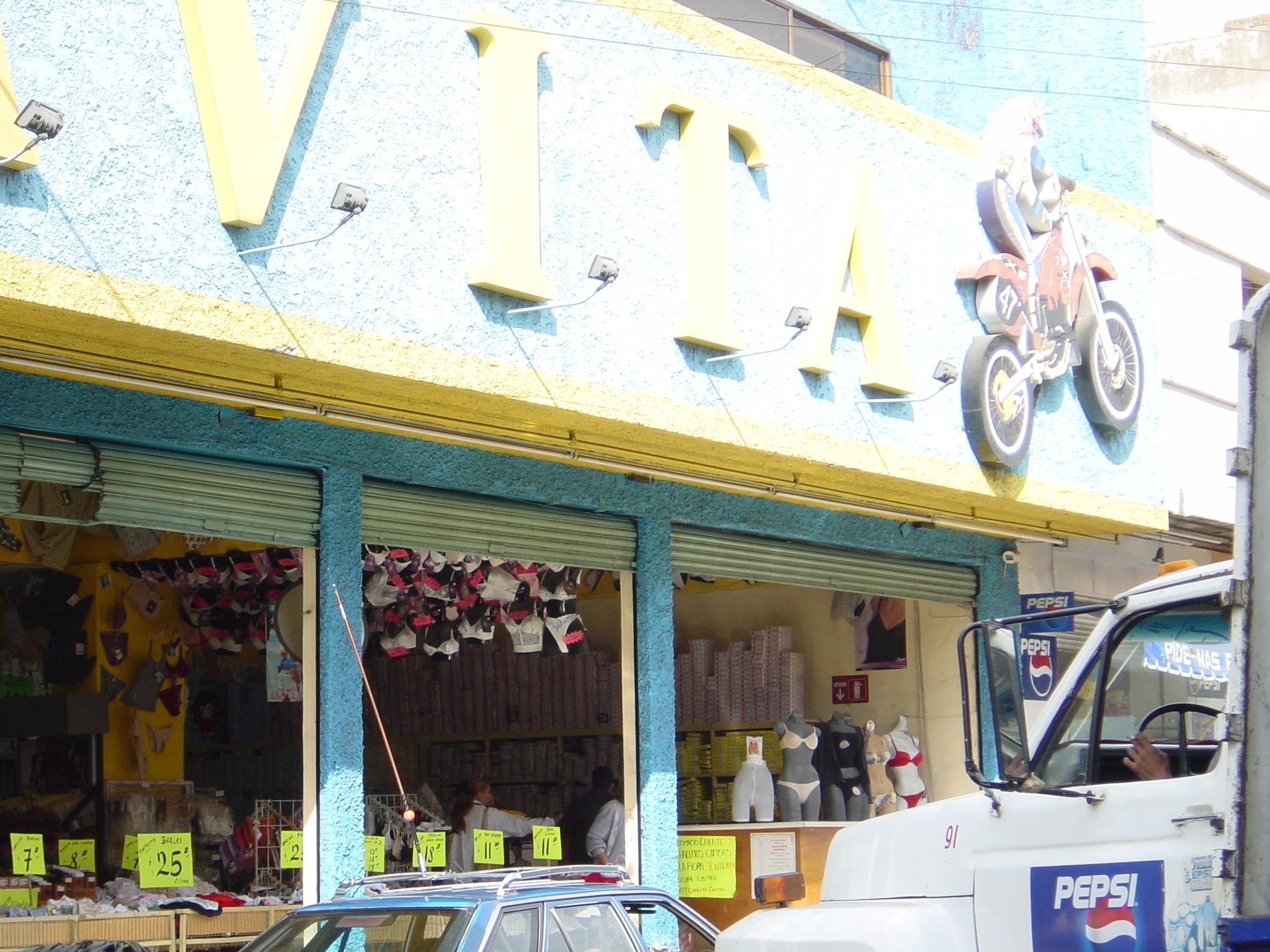 We walked past this shop while looking for a bar. With the shutters down it was obviously a bike shop and a good place to start looking for a new rear tyre. We were slightly amused the next day when we returned to find other items for the rear.