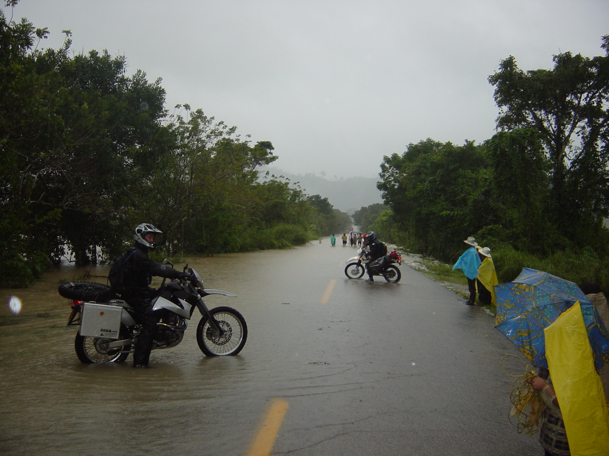 Should we walk it first? No, let's go. (Crossing flooded road)